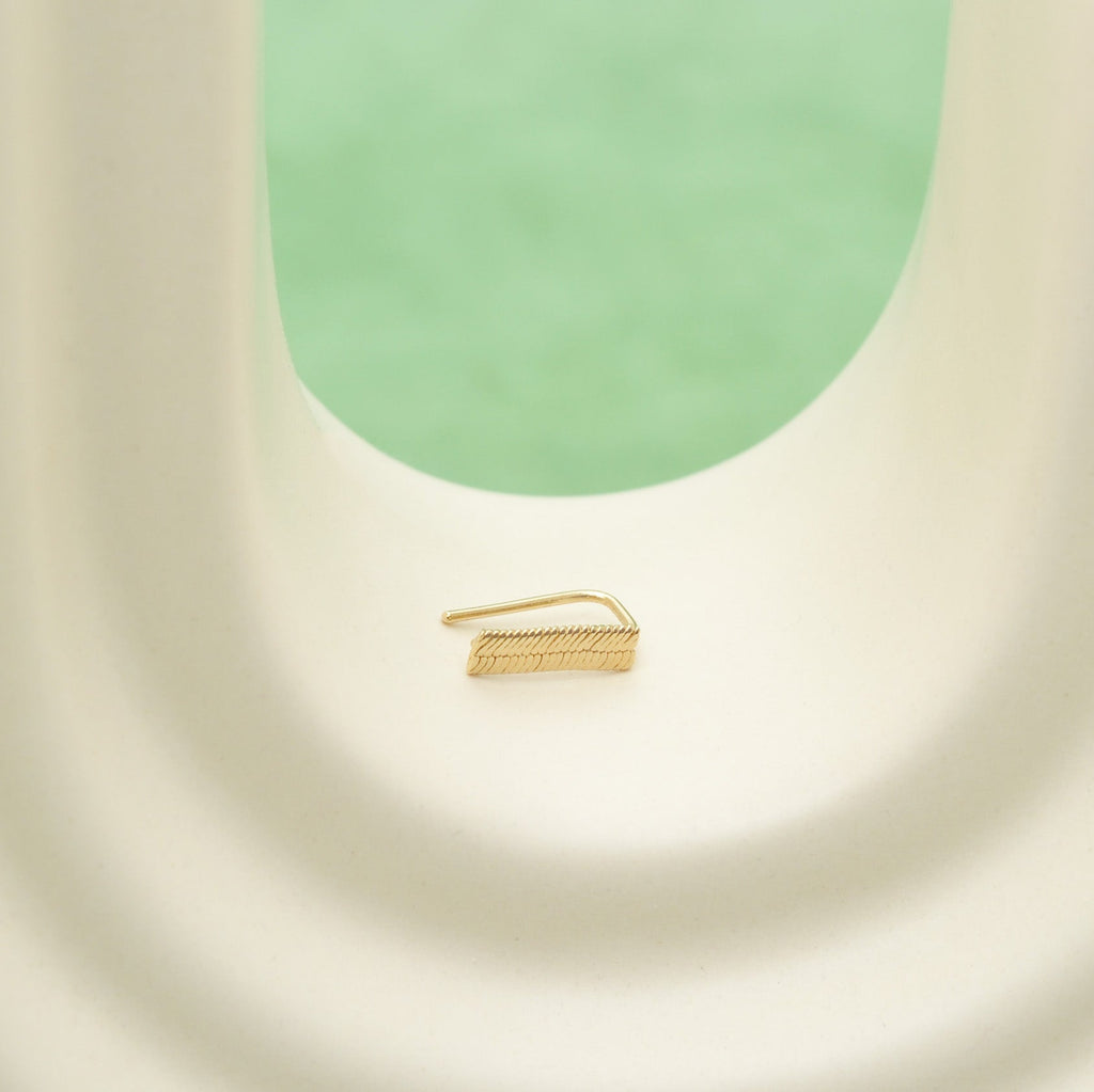 Climber oreille collection Mirage taille mini, posé sur une arche